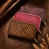 Tannor Irodori hand-woven cowhide long wallet, all three colours, Fuchsia, Cognac and Burgundy, stacked together