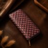 Tannor Irodori hand-woven cowhide long wallet in Burgundy, front diagonal view of the woven panel