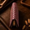 Tannor Irodori hand-woven cowhide long wallet in Burgundy, end-on view showing the slim profile
