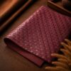 Tannor Irodori hand-woven cowhide long wallet in Burgundy, close-up of the hand-woven leather texture