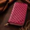Tannor Irodori hand-woven cowhide long wallet in Fuchsia, front diagonal view of the woven panel