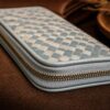 Tannor Irodori hand-woven cowhide long wallet in Cerulean, end-on view showing the slim profile