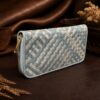 Tannor Irodori hand-woven cowhide long wallet in Cerulean, front diagonal view of the woven panel