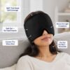 Woman relaxing on a sofa wearing the black gel cap over her eyes with callouts for 360 degree full head gel coverage
