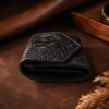 Tannor crocodile-embossed leather envelope wallet in black, side profile showing the slim depth