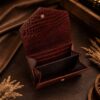 Tannor crocodile-embossed leather envelope wallet in chocolate brown, open, showing the card slots
