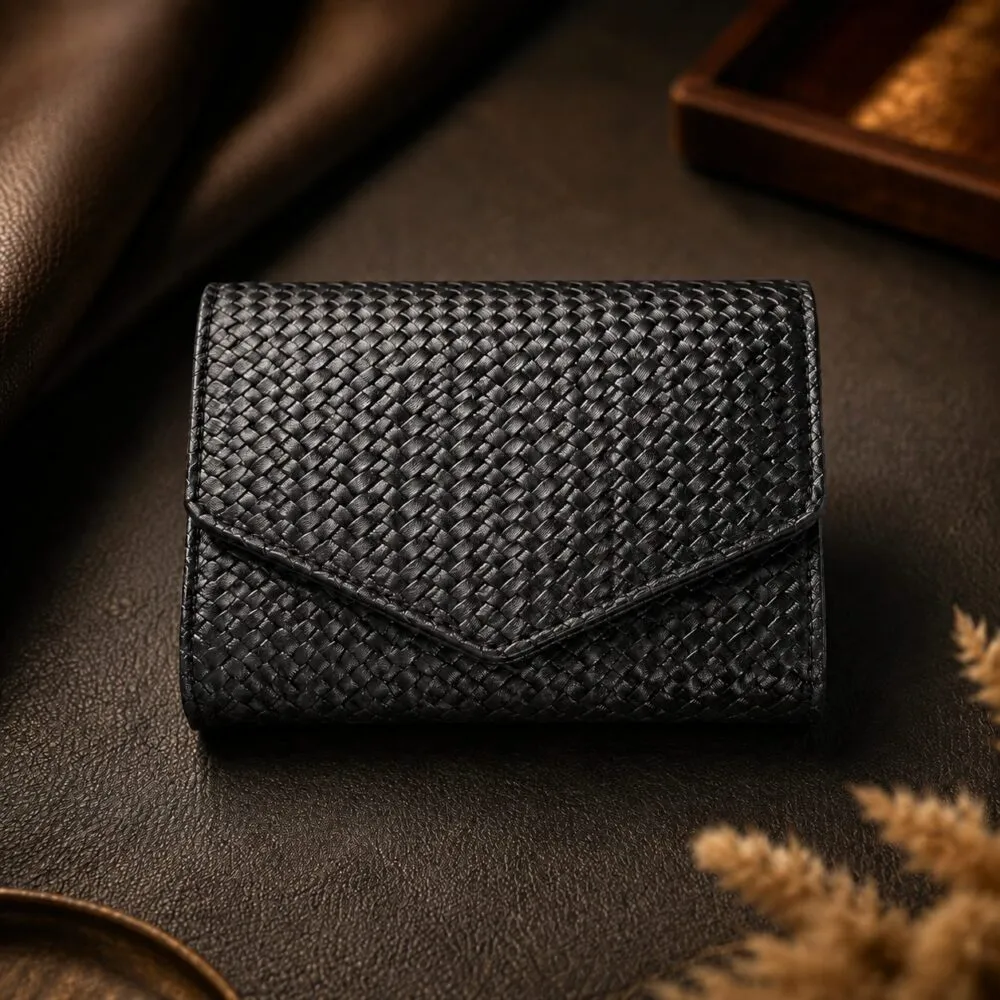 Tannor woven leather envelope wallet in black, front view